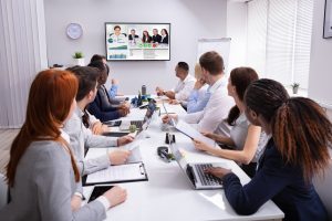 A group of young professionals participating in a productive conference call.